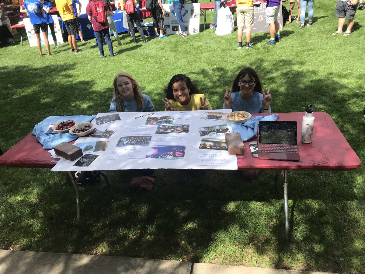 officers at fall activities fair table